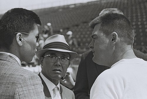dave macdonbald and parnelli jones in Indy garage area in 1964